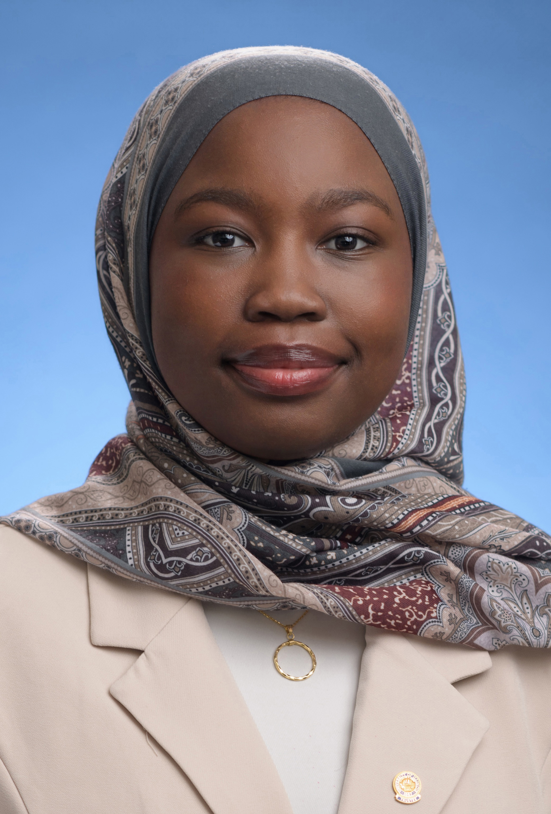 Trustee Shekoni
